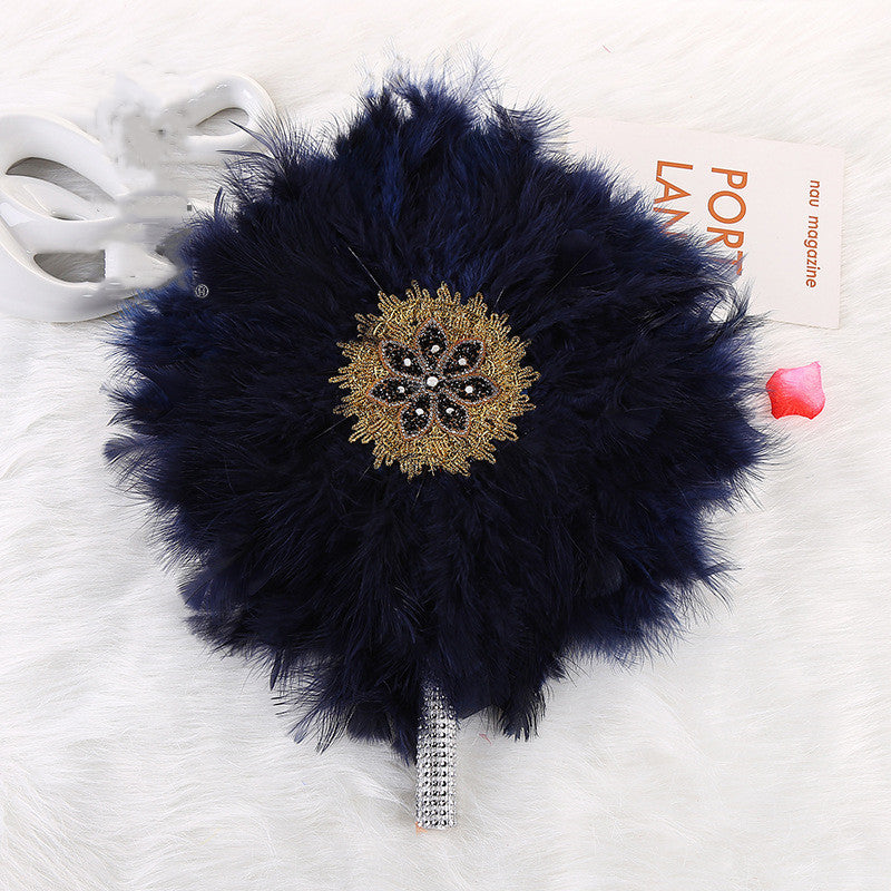 African Wedding Bride And Bridesmaid Holding A Big Round Feather Fan