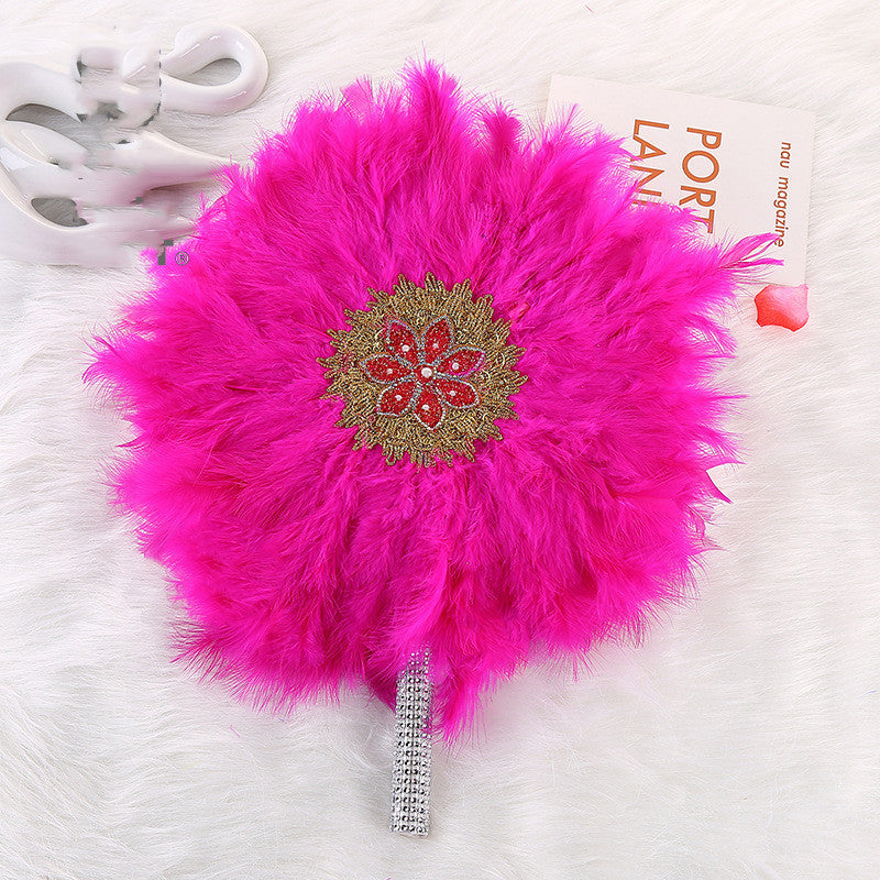 African Wedding Bride And Bridesmaid Holding A Big Round Feather Fan