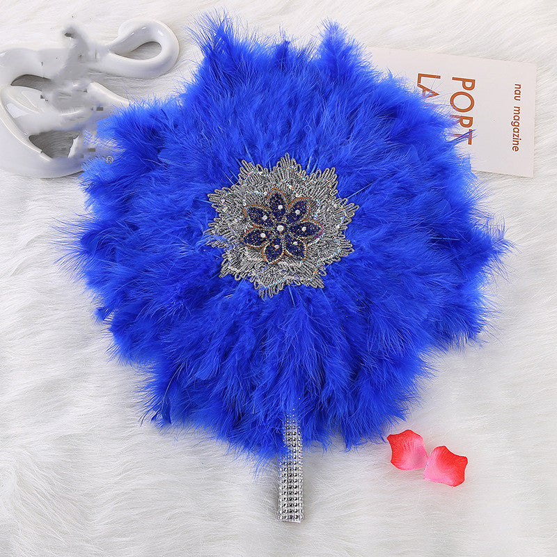 African Wedding Bride And Bridesmaid Holding A Big Round Feather Fan