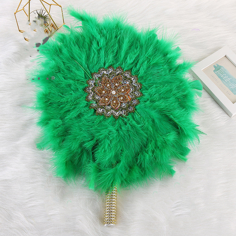 African Wedding Bride And Bridesmaid Holding A Big Round Feather Fan