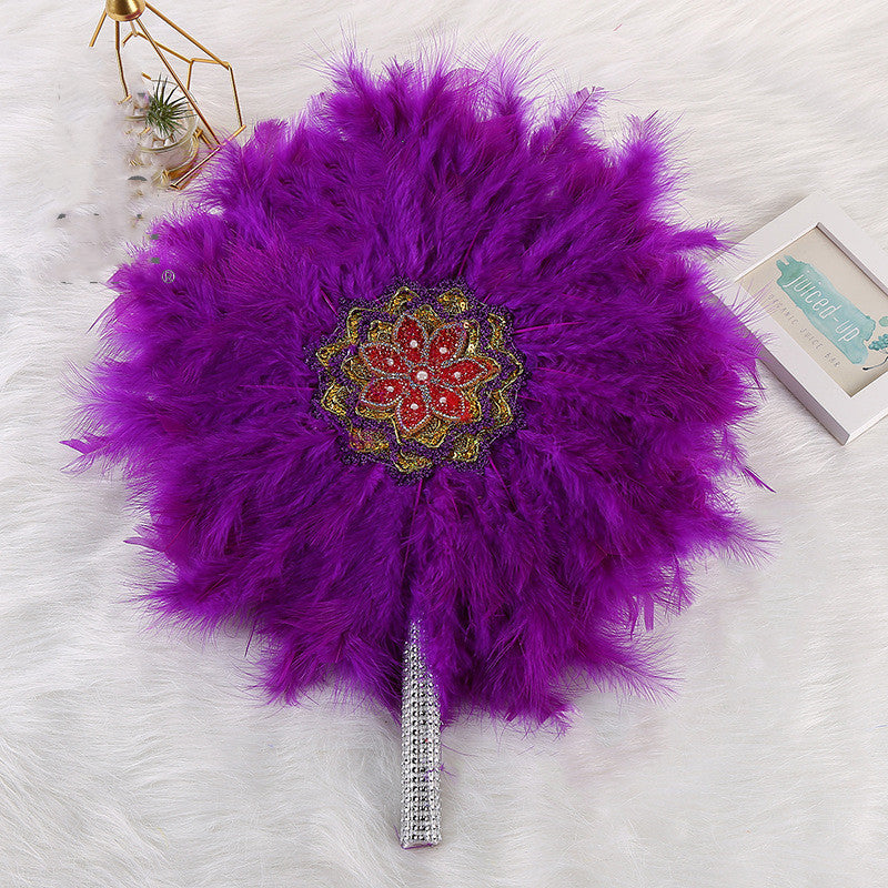 African Wedding Bride And Bridesmaid Holding A Big Round Feather Fan